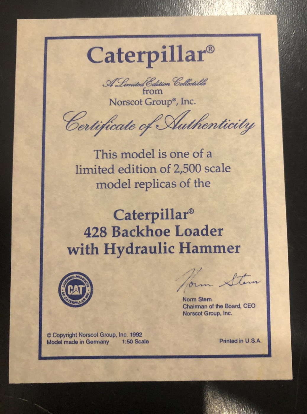 NZG #378 CAT Caterpillar 428 Backhoe Loader w/ Hammer – 1:50 – Limited Edition