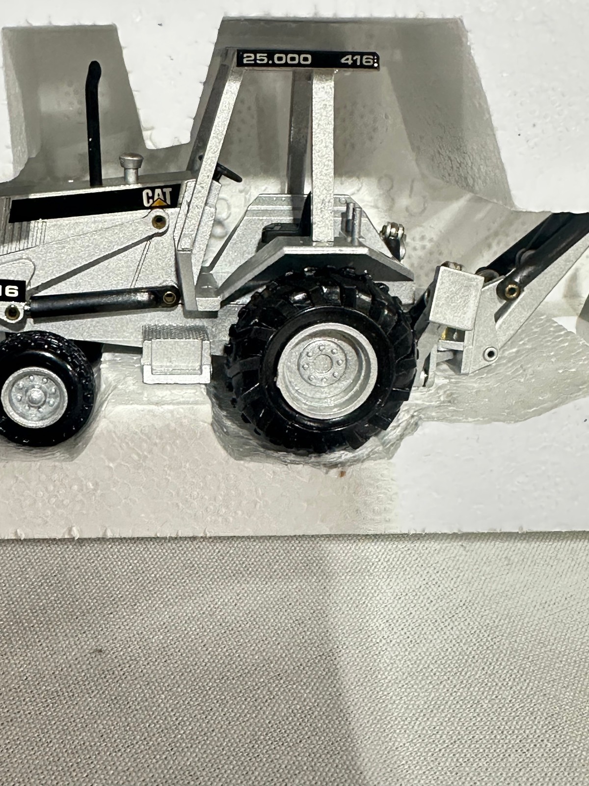 Caterpillar 416 Backhoe Loader 25,000th Silver Edition By NZG 1/50th Scale