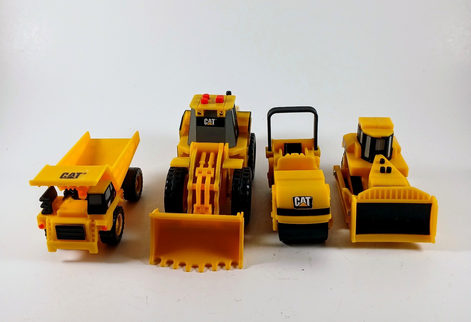 Vintage Set of 4 Caterpillar (CAT) Construction Vehicle Toys Between 2.5″-6″