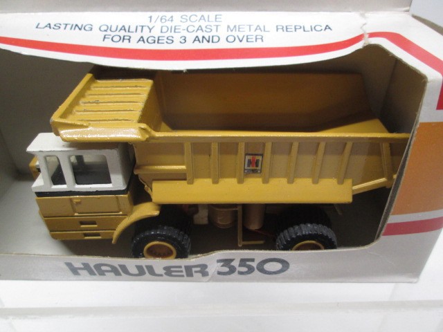 ERTL 1/64 MIGHTY MOVERS INTERNATIONAL CONSTRUCTION TOYS – LOT OF 4 – MINT-IN-BOX