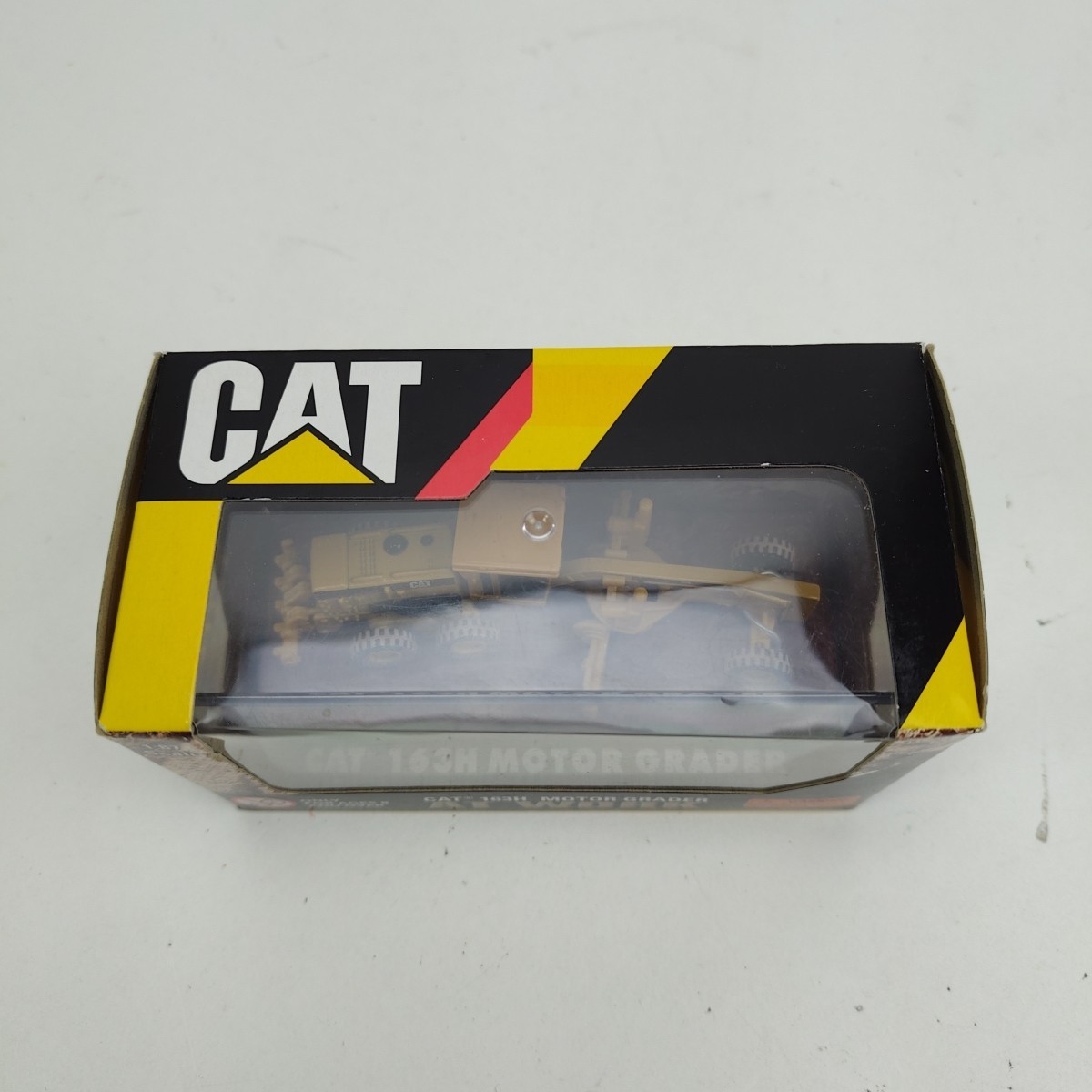 NORSCOT CAT 1:87 HO 163H Motor Grader At Work (Yellow) Diecast Caterpillar 55437