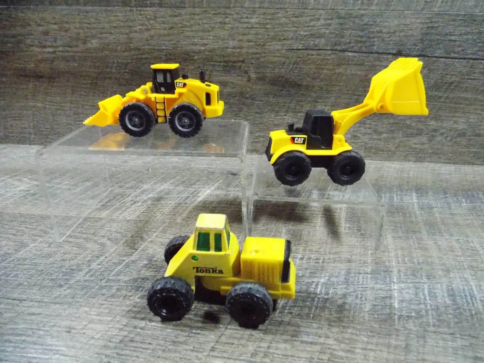 Yellow Metal & Plastic Tonka Tractor & 2 Plastic CAT Caterpillar Loaders 3 to 4″