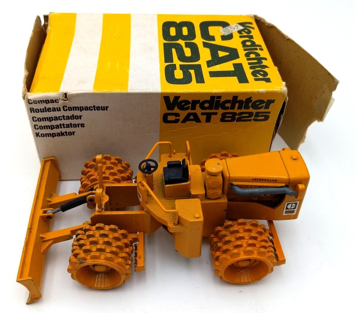 NZG 135 1:50 Scale Diecast Caterpillar 825 Compactor – Yellow/Box