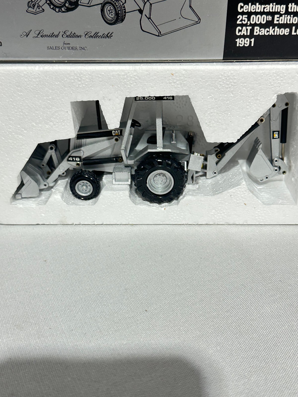 Caterpillar 416 Backhoe Loader 25,000th Silver Edition By NZG 1/50th Scale