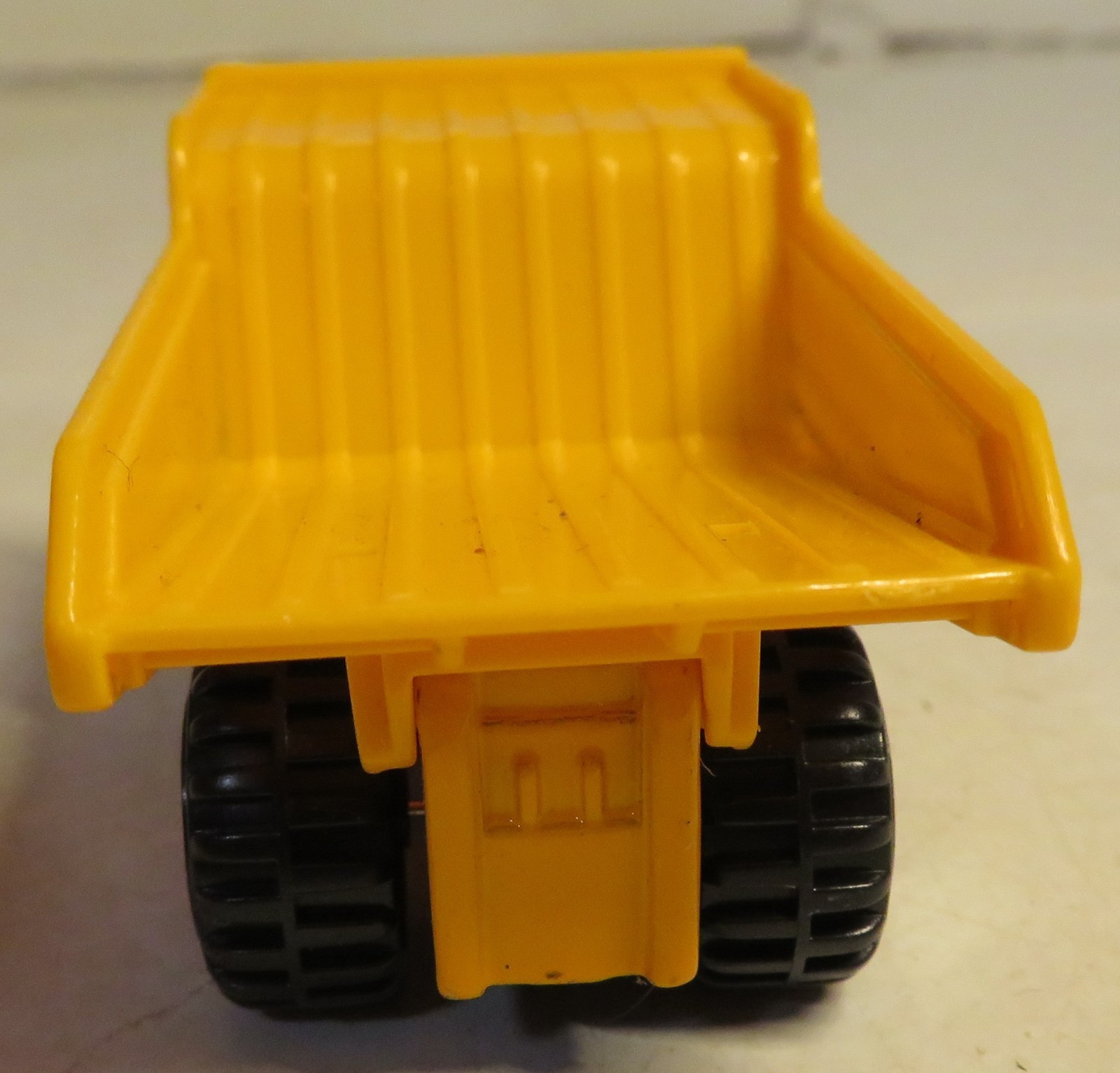 Hercules Classic Construction Toy 3″ Long Dump Truck Yellow Plastic Grading Haul